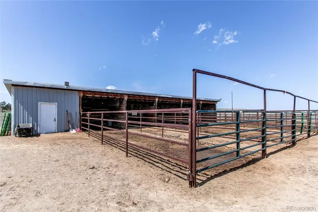 a view of staircase with wooden floor and a window