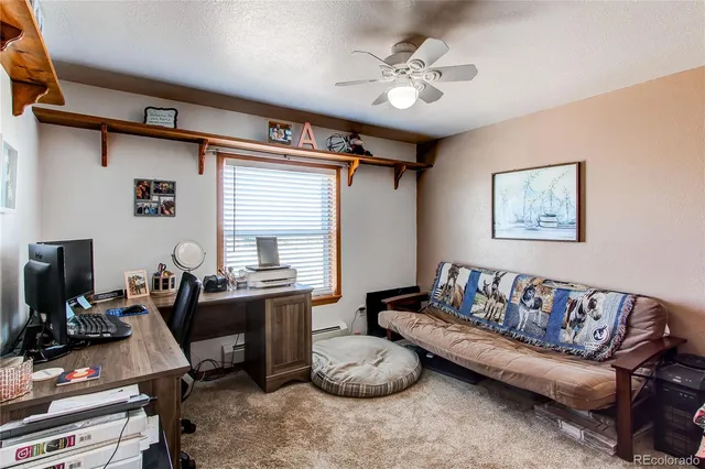 a big room with wooden floor and furniture