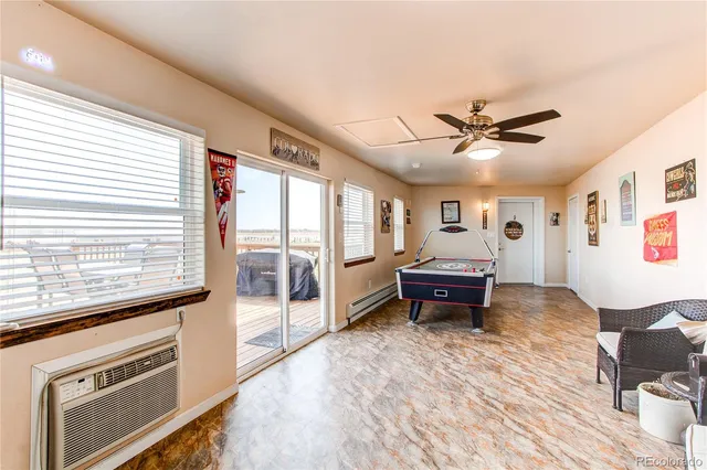 a living room with furniture and a dining room
