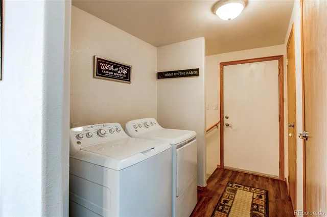 a bedroom with a bed and dresser with mirror