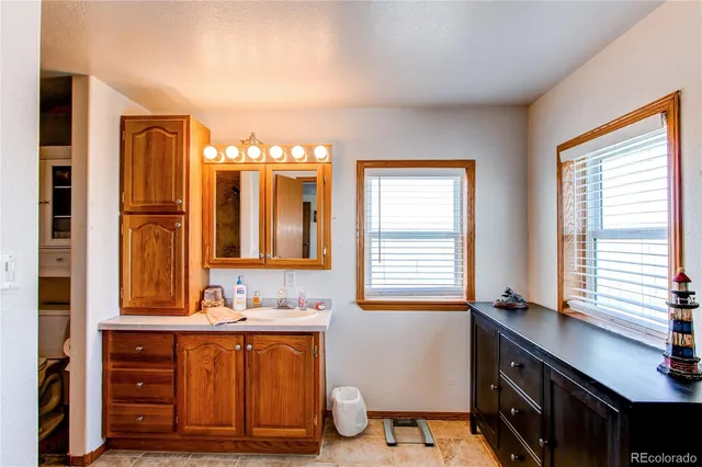 a view of workspace with wooden floor windows