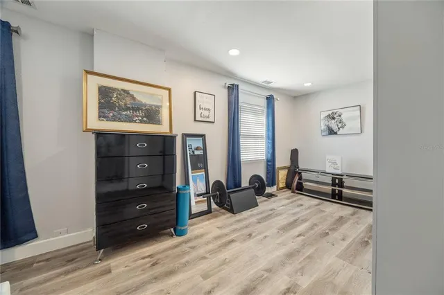 a view of living room with furniture and flat screen tv