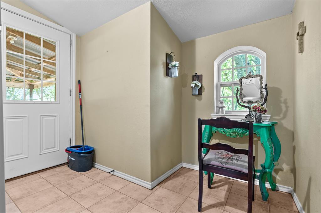1355 North Houston Street Lorena, TX 76655 - Photo 25 of 40 a view of a livingroom with furniture window and a fireplace