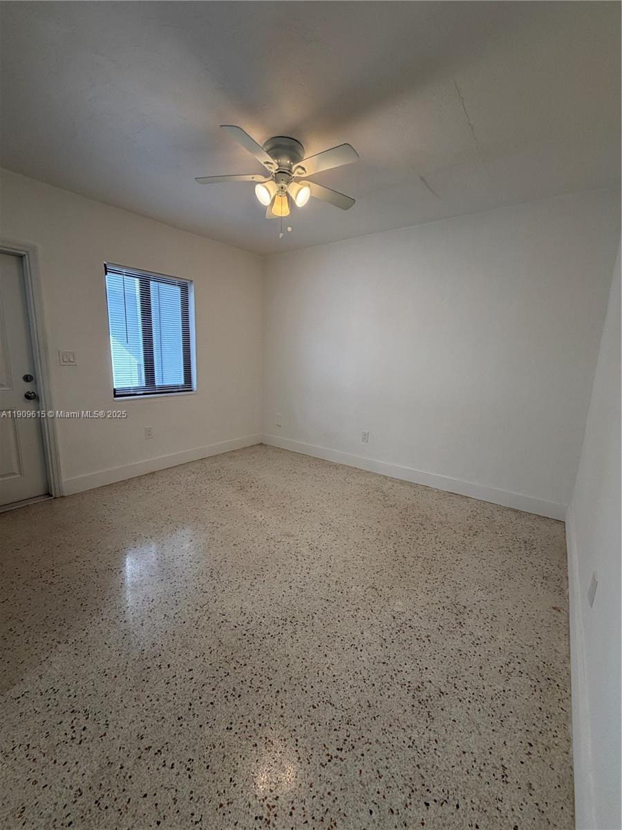 600 Southwest 10th Street, Unit 3 Miami, FL 33130 - Photo 12 of 17 an empty room with a fan & a window