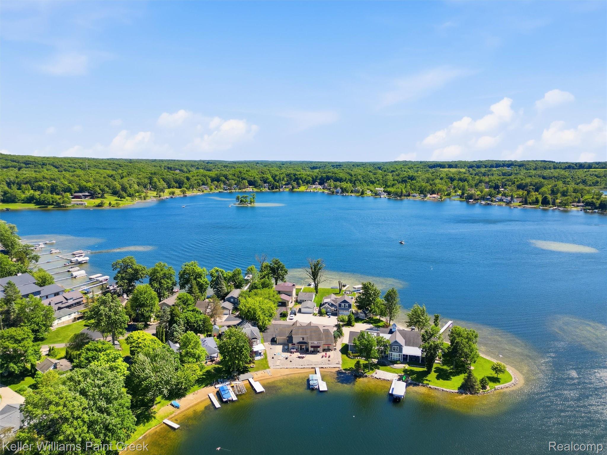 10435 Spring Street Fenton, MI 48430 - Photo 4 of 40 Expansive lakefront property featuring a private sandy beach and multiple private docks