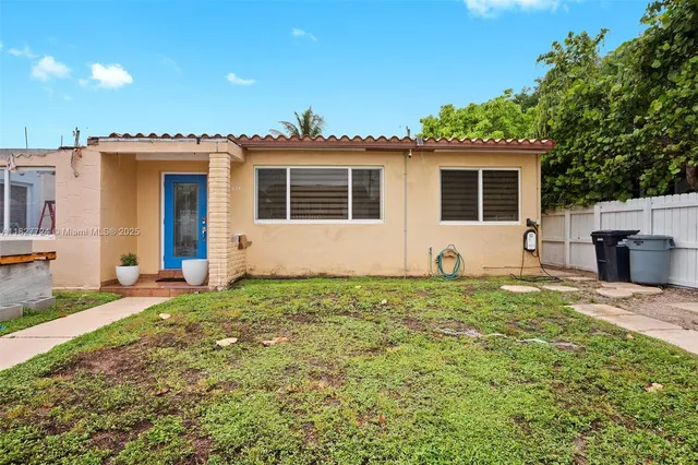 a house view with a garden space