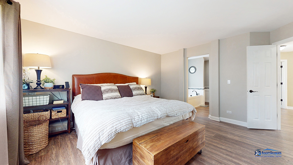 788 North Overlook Trail Round Lake, IL 60073 - Photo 22 of 45 a spacious bedroom with a bed and wooden floor