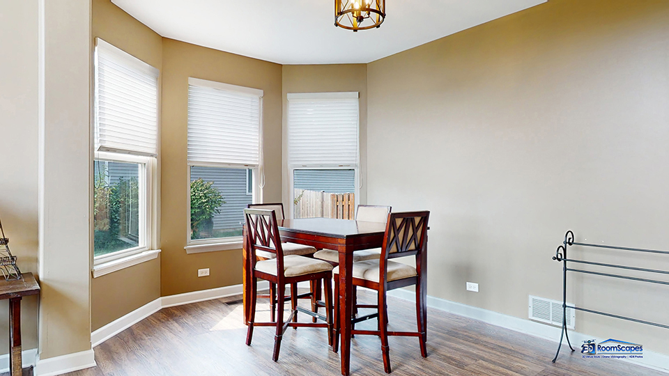 788 North Overlook Trail Round Lake, IL 60073 - Photo 3 of 45 a view of a dining room with furniture and wooden floor