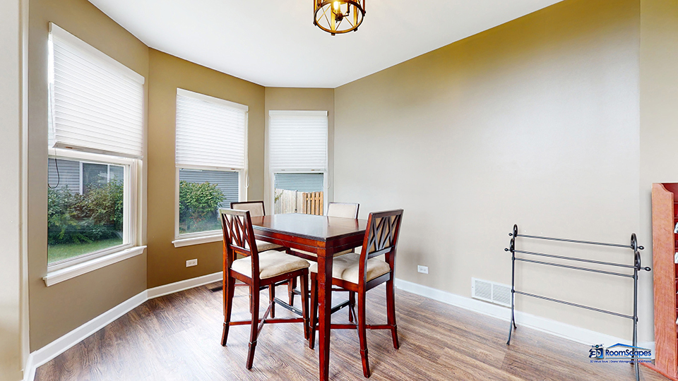 788 North Overlook Trail Round Lake, IL 60073 - Photo 7 of 45 a view of a dining room with furniture and wooden floor