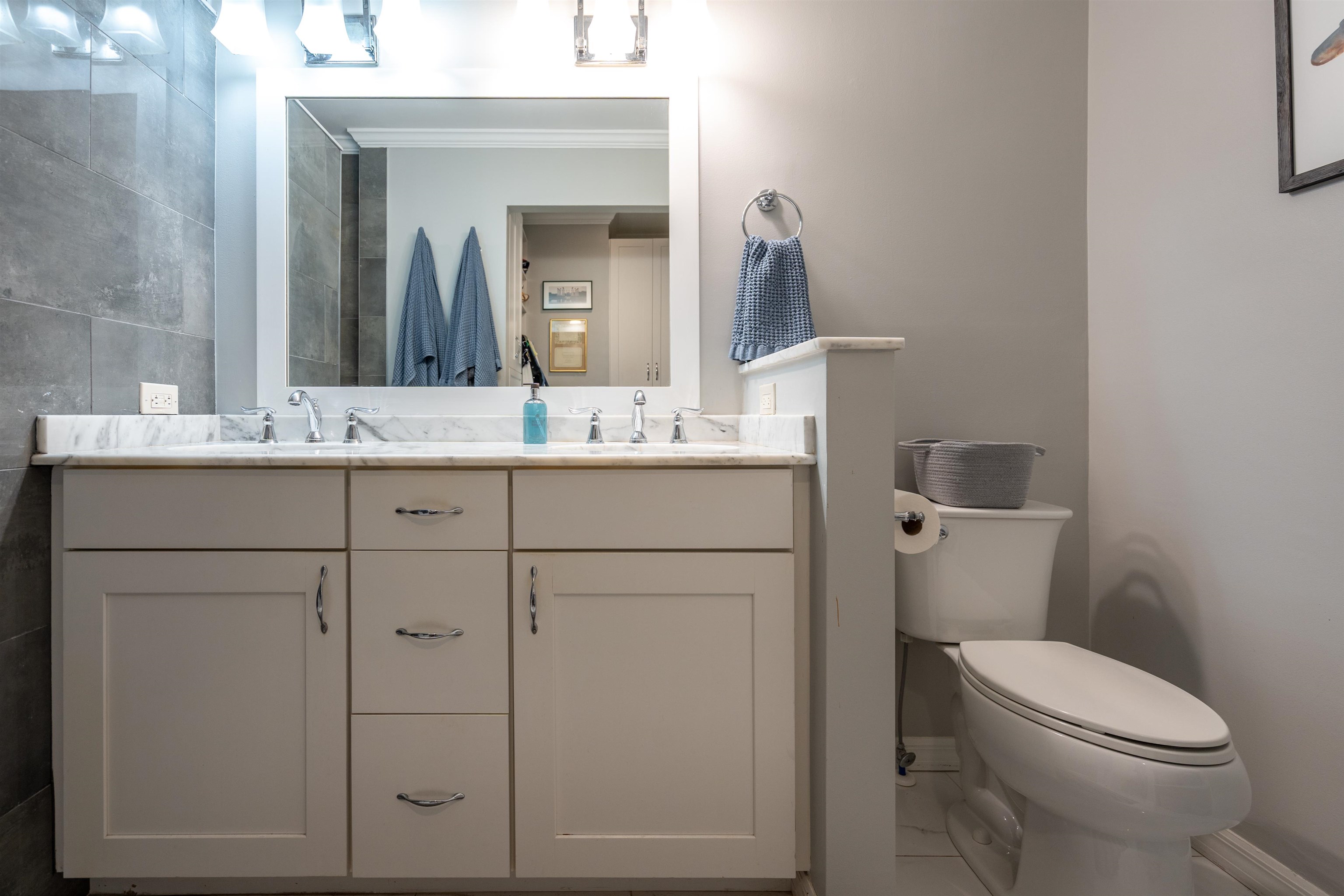 890 A1A Beach Boulevard, Unit 75 St. Augustine, FL 32080 - Photo 20 of 39 a bathroom with a toilet sink vanity and mirror