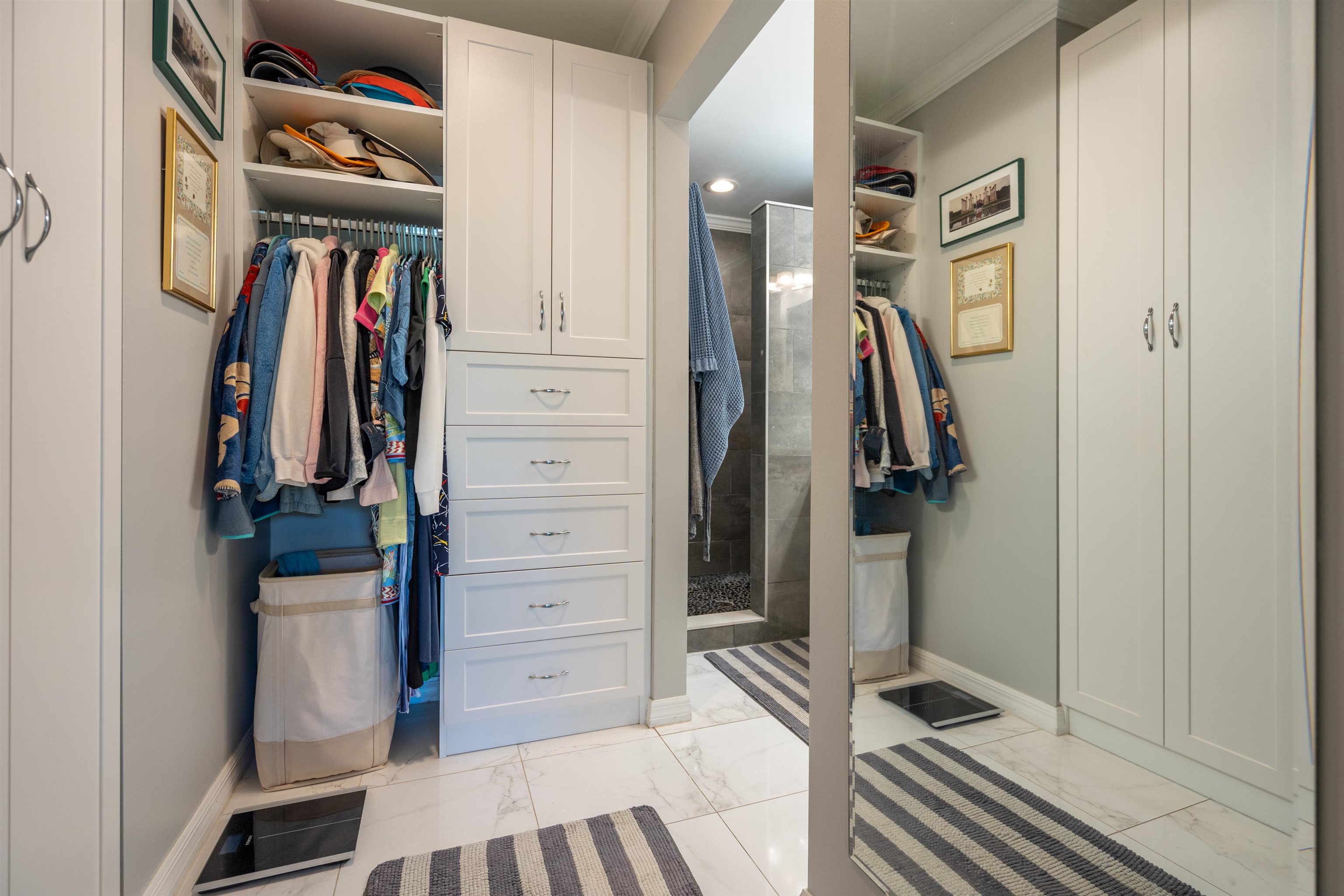 890 A1A Beach Boulevard, Unit 75 St. Augustine, FL 32080 - Photo 22 of 39 a view of walk in closet with clothes and shoes