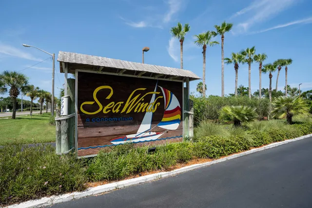 a sign that is on the wall of the house