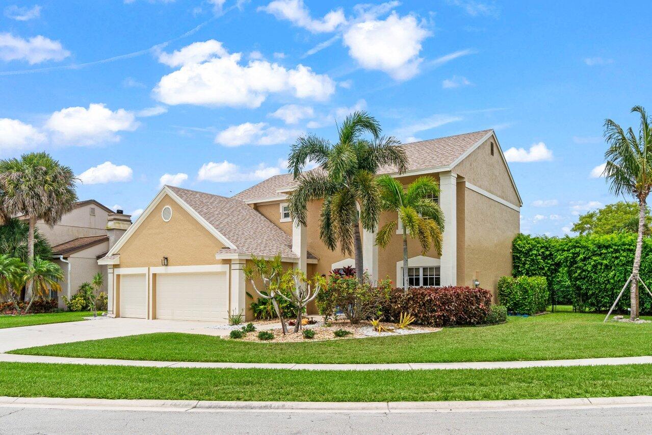 22145 Appleton Drive Boca Raton, FL 33428 - Photo 1 of 31 a front view of a house with a yard and garage