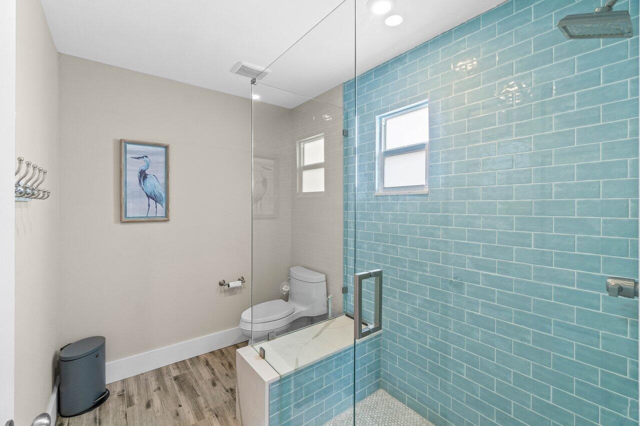 22145 Appleton Drive Boca Raton, FL 33428 - Photo 20 of 31 a bathroom with a sink a toilet and mirror