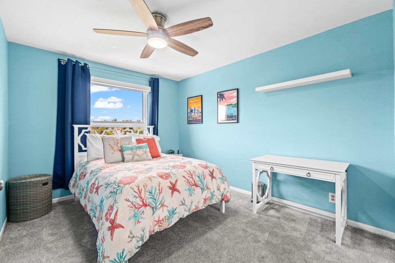 22145 Appleton Drive Boca Raton, FL 33428 - Photo 25 of 31 a bedroom with a bed and a chandelier