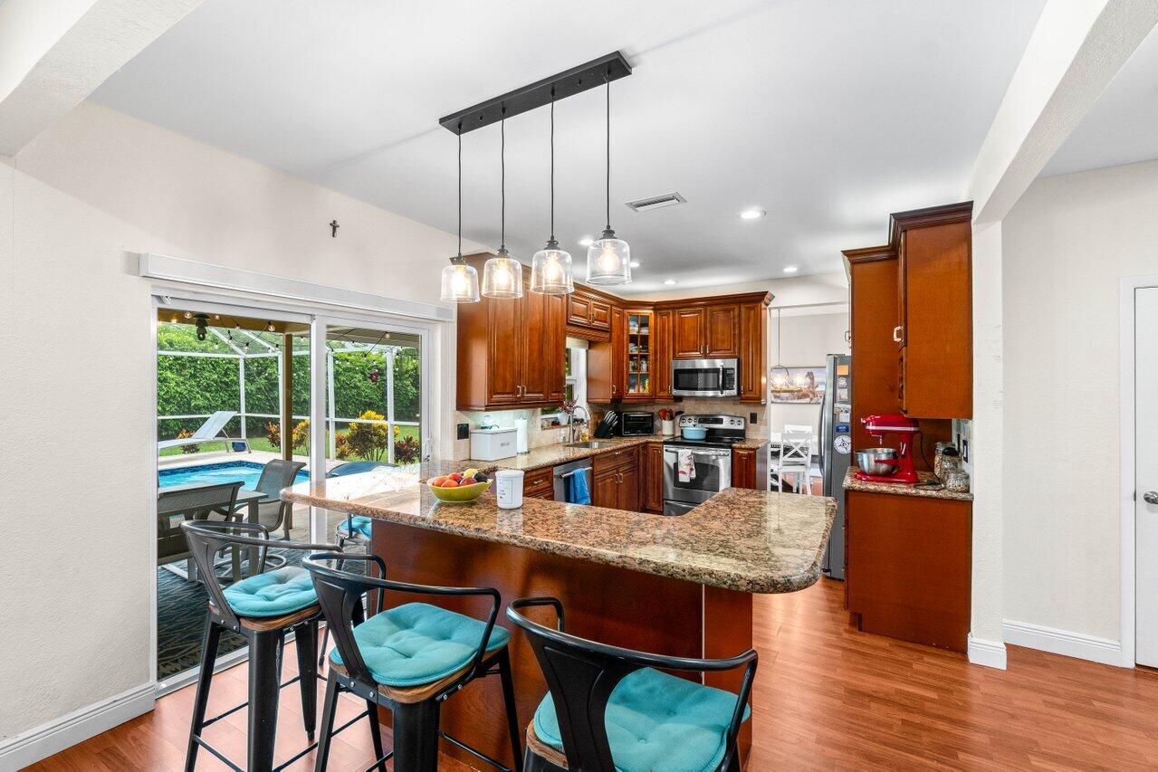 22145 Appleton Drive Boca Raton, FL 33428 - Photo 8 of 31 a view of a dining room with furniture window and wooden floor
