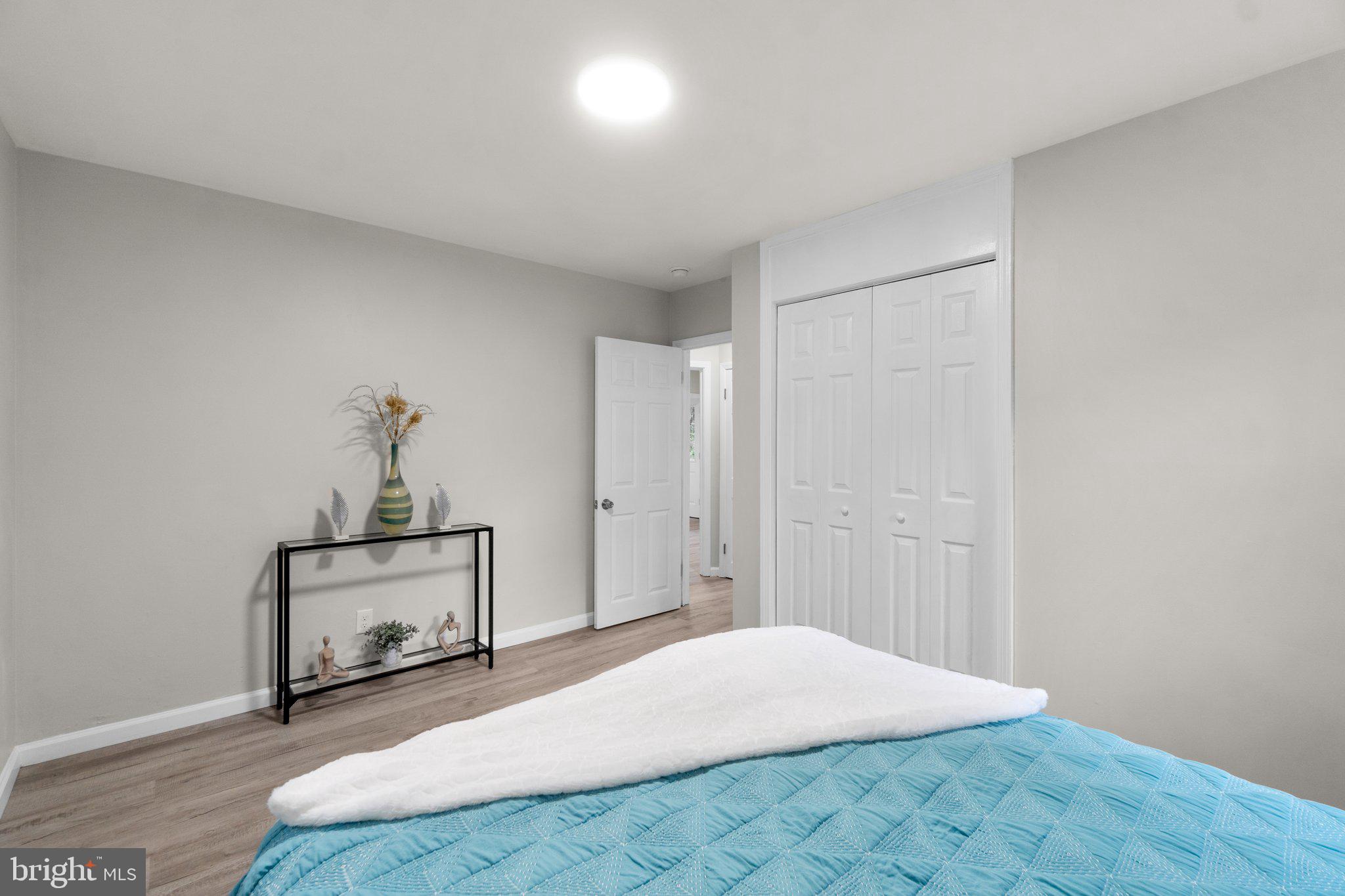 3648 Clifmar Road Windsor Mill, MD 21244 - Photo 11 of 22 a bedroom with a bed and a table