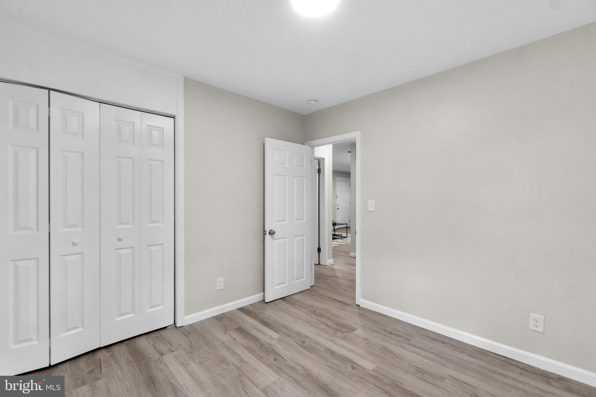 3648 Clifmar Road Windsor Mill, MD 21244 - Photo 13 of 22 a view of an empty room and wooden floor