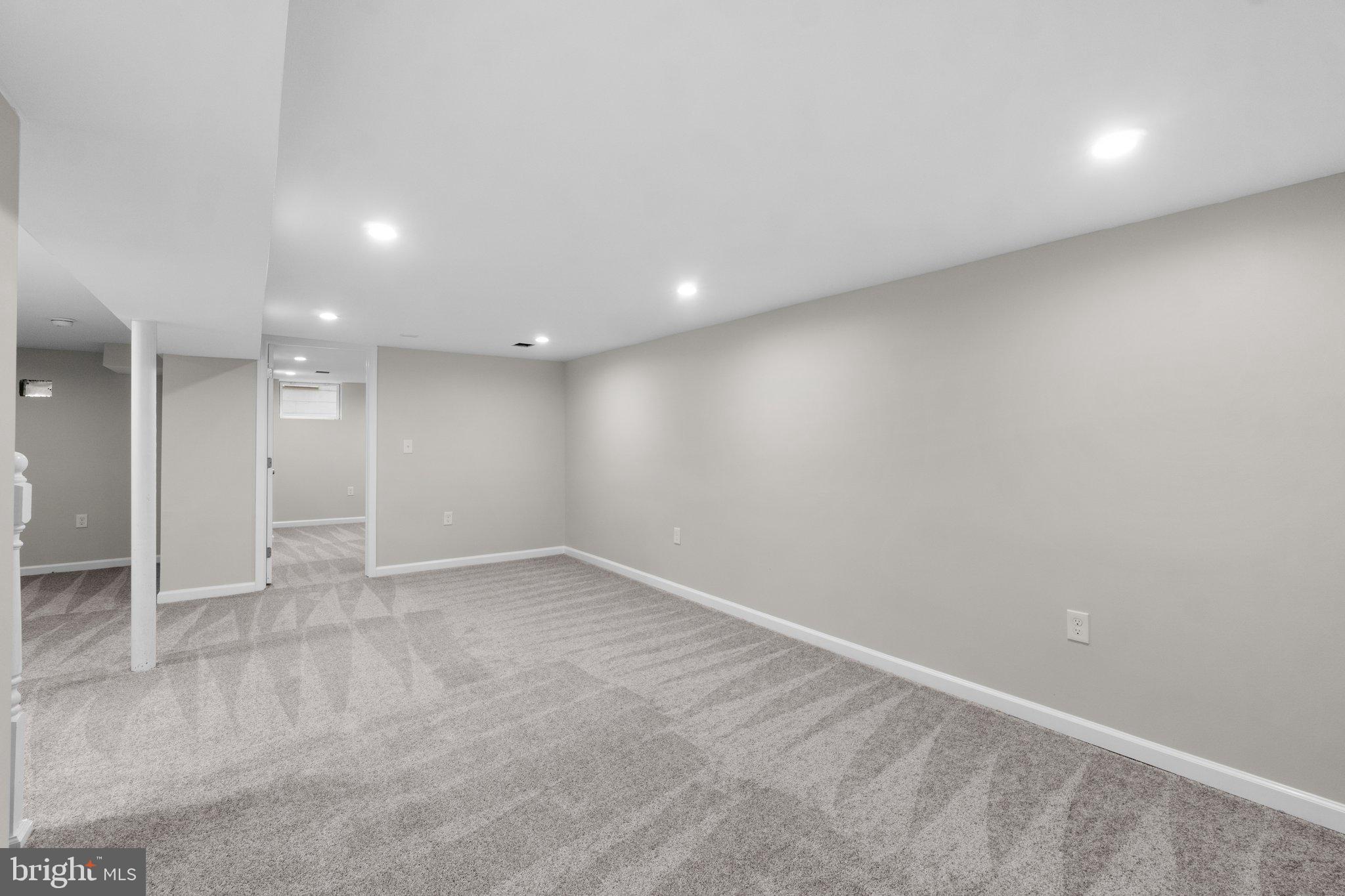 3648 Clifmar Road Windsor Mill, MD 21244 - Photo 18 of 22 an empty room with a empty space and windows