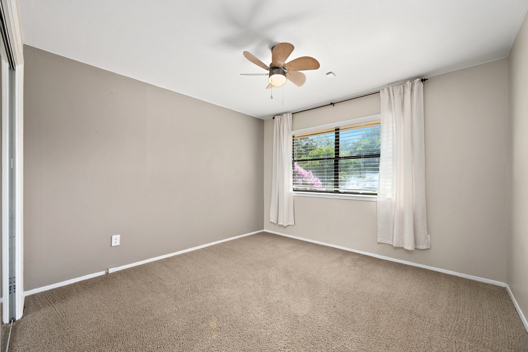 3908 Valley View Round Rock, TX 78681 - Photo 23 of 39 Upstairs bedroom one offers a comfortable layout, ceiling fan, and a window view.