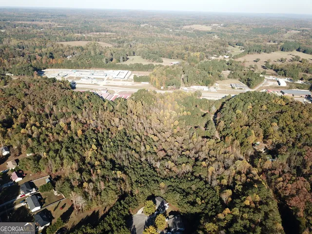 an aerial view of houses with yard
