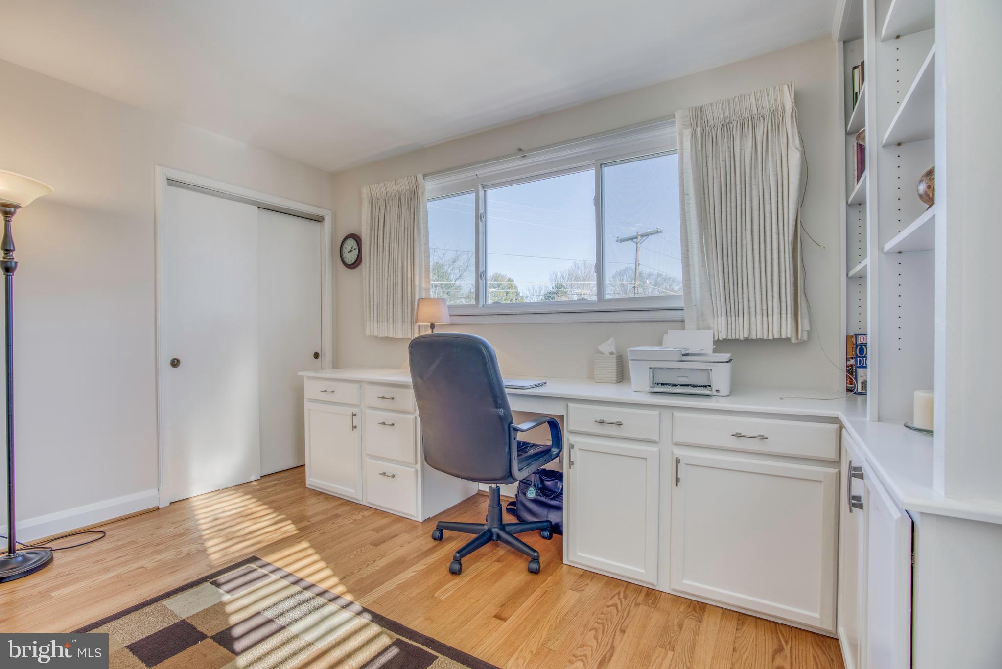 1305 Glendale Road Baltimore, MD 21239 - Photo 18 of 49 a view of a workspace with furniture and a window