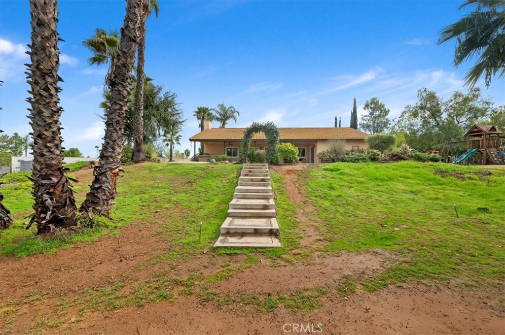 14231 Alexander Street Riverside, CA 92508 - Photo 33 of 36 a front view of a house with a yard