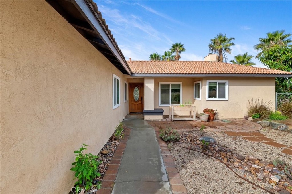 14231 Alexander Street Riverside, CA 92508 - Photo 5 of 36 a front view of a house with garden