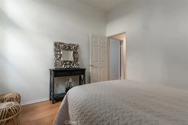 a bedroom with a bed and a fireplace