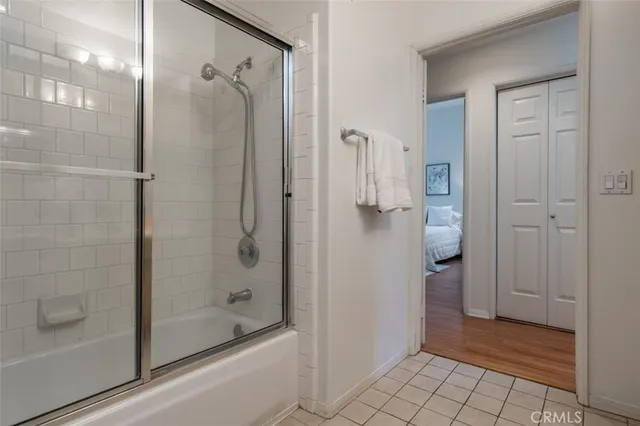 a bathroom with a glass shower door