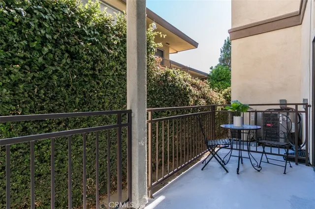 a view of a balcony with chairs