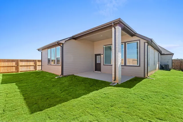 an aerial view of a house with a swimming pool