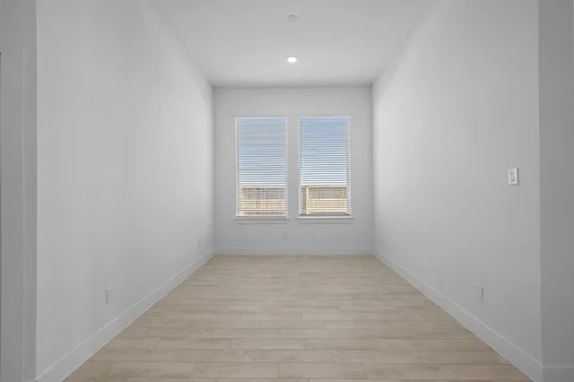 a living room with kitchen island furniture and ceiling fan