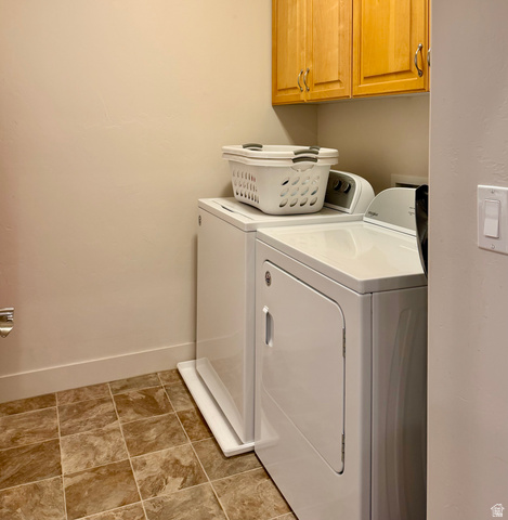 1204 South 1150th Street West Payson, UT 84651 - Photo 6 of 26 Dedicated main floor laundry area featuring a tile-patterned floor, cream-colored walls, and natural wood cabinetry