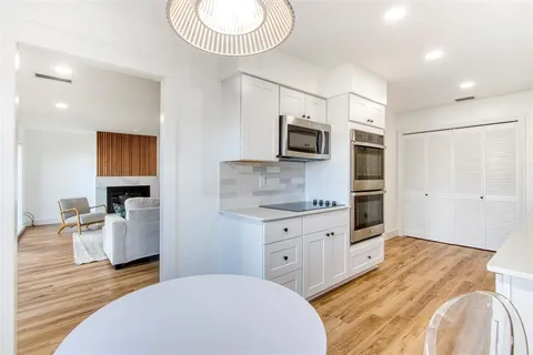 a spacious bedroom with a bed and furniture