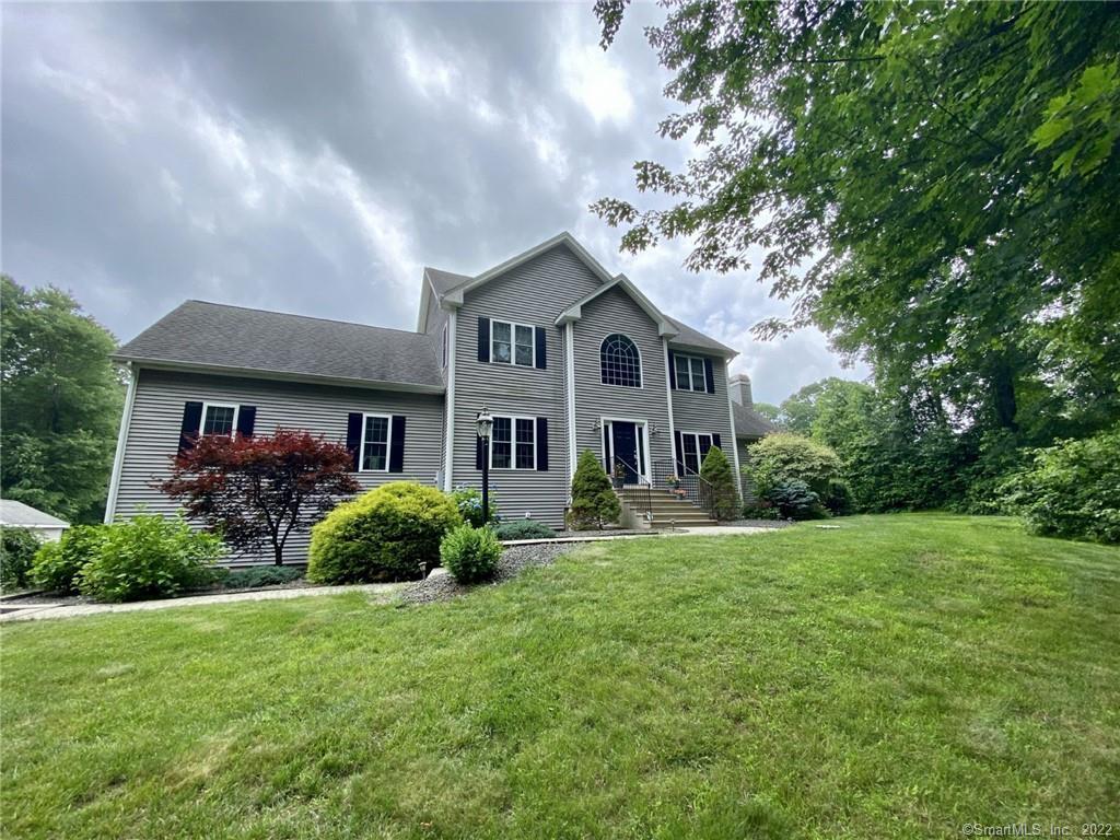 195 Fowler Road Lebanon, CT 06249 - Photo 1 of 1 a front view of a house with a garden
