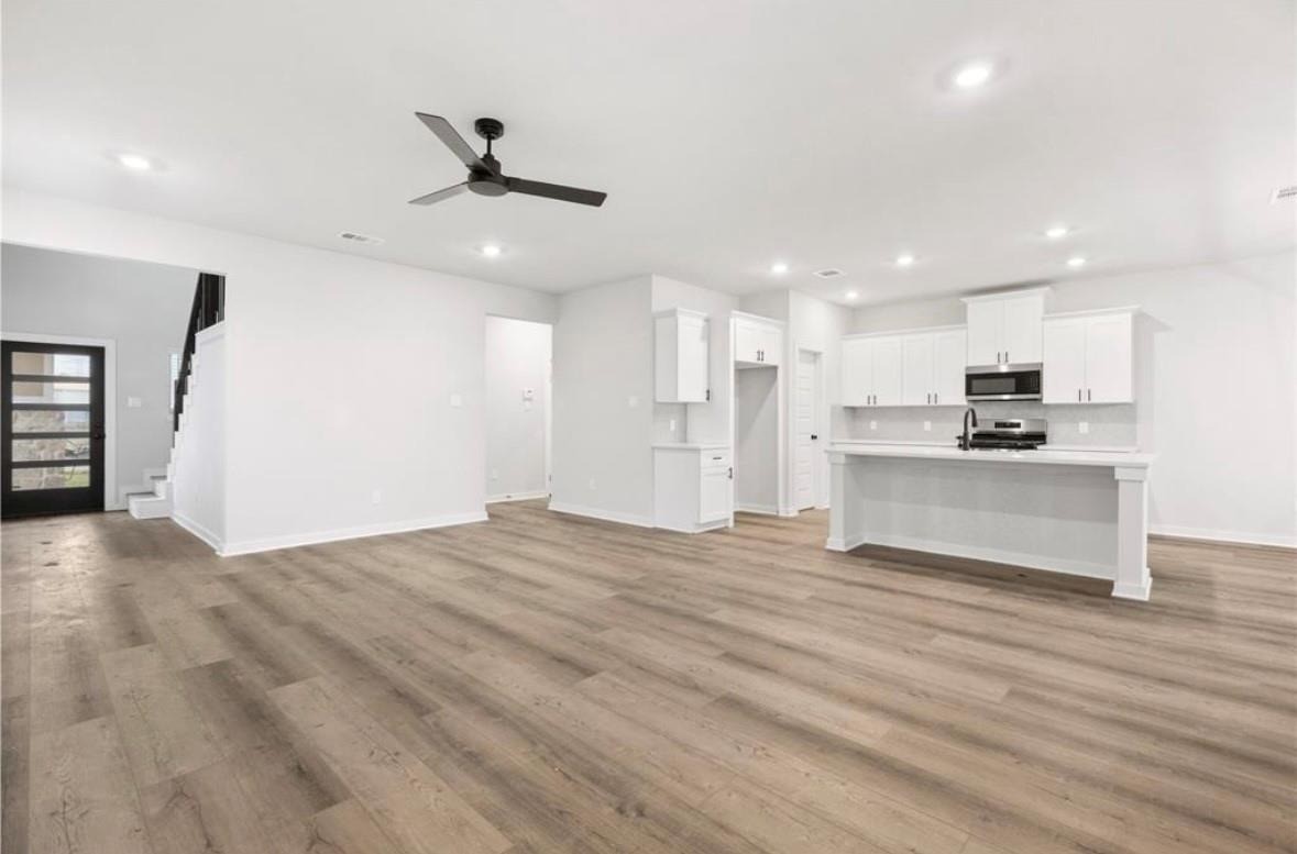6427 Bolinas Court Rosharon, TX 77583 - Photo 3 of 23 a view of kitchen with wooden floor and window