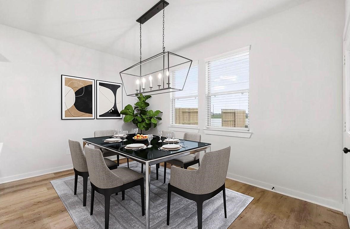 6427 Bolinas Court Rosharon, TX 77583 - Photo 7 of 23 a dining room with furniture a chandelier and wooden floor