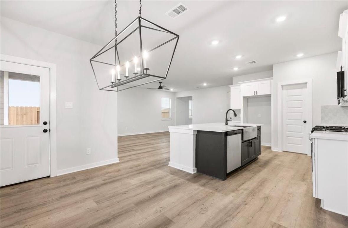 6427 Bolinas Court Rosharon, TX 77583 - Photo 8 of 23 a view of kitchen with sink and wooden floor