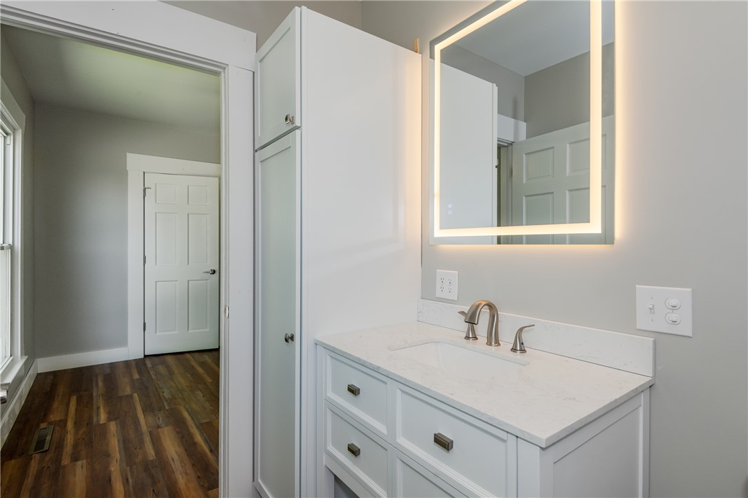 1217 Jasper Road Xenia, OH 45385 - Photo 41 of 62 This sleek bathroom features a modern vanity with elegant fixtures and a luminous mirror.