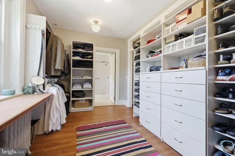 a room with a furniture and a book shelf