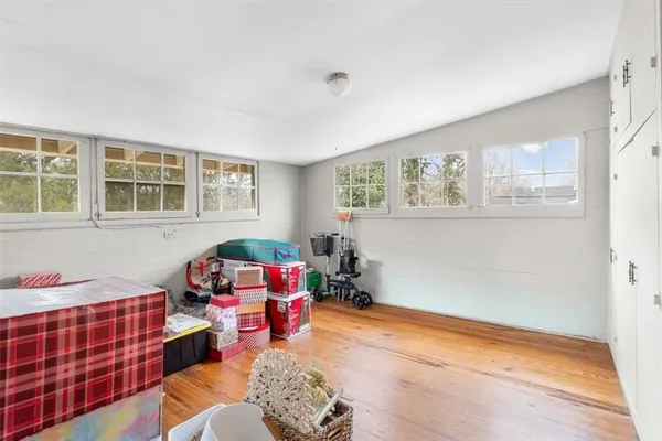 a bedroom with furniture and a window