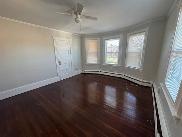 a view of room with window and hardwood floor