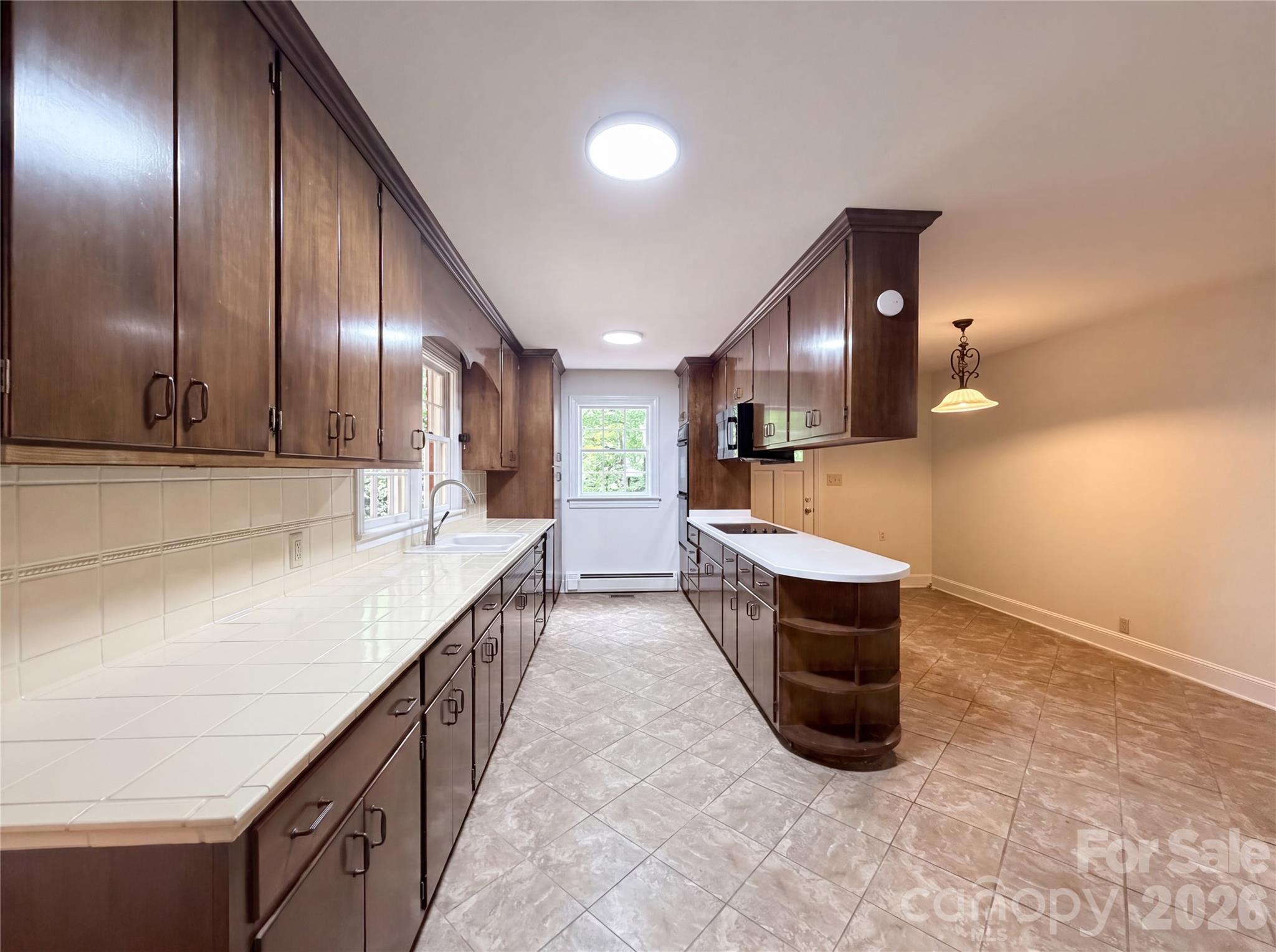 318 Valley Stream Road Statesville, NC 28677 - Photo 2 of 21 a kitchen with stainless steel appliances kitchen island granite countertop a sink and cabinets