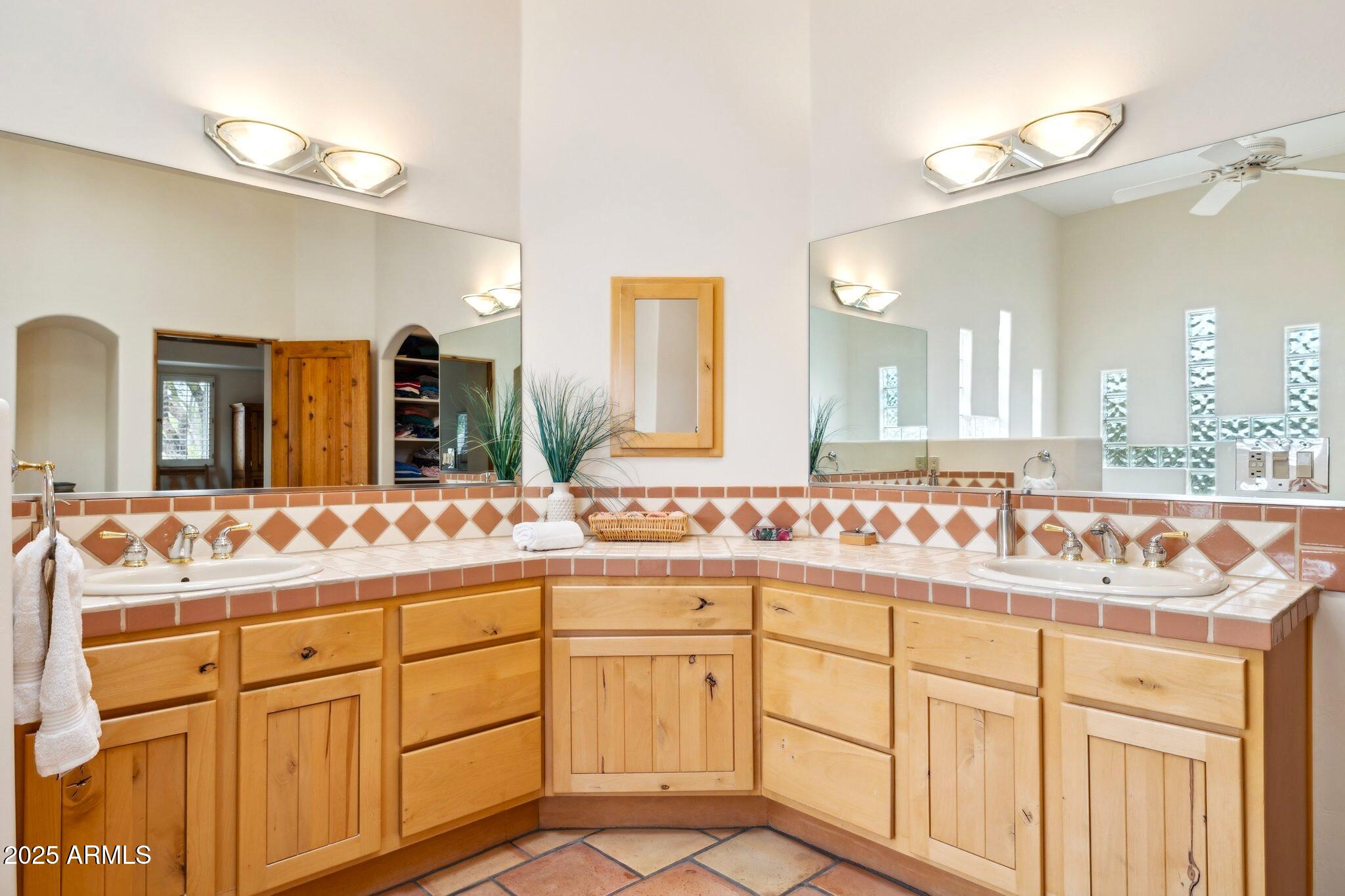 30600 North Pima Road, Unit 38 Scottsdale, AZ 85266 - Photo 26 of 49 a bathroom with a sink vanity and mirror