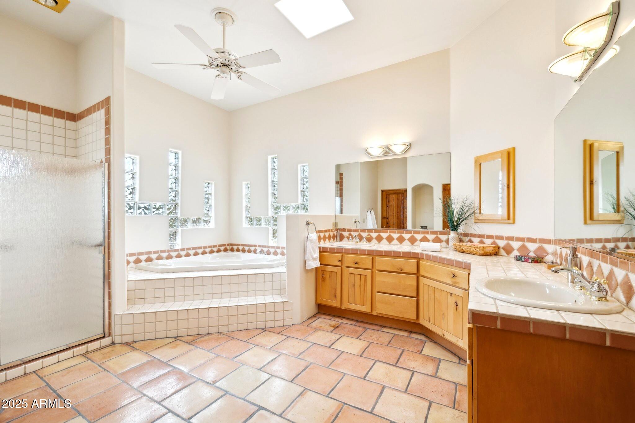 30600 North Pima Road, Unit 38 Scottsdale, AZ 85266 - Photo 27 of 49 a bathroom with a sink a vanity and a bathtub