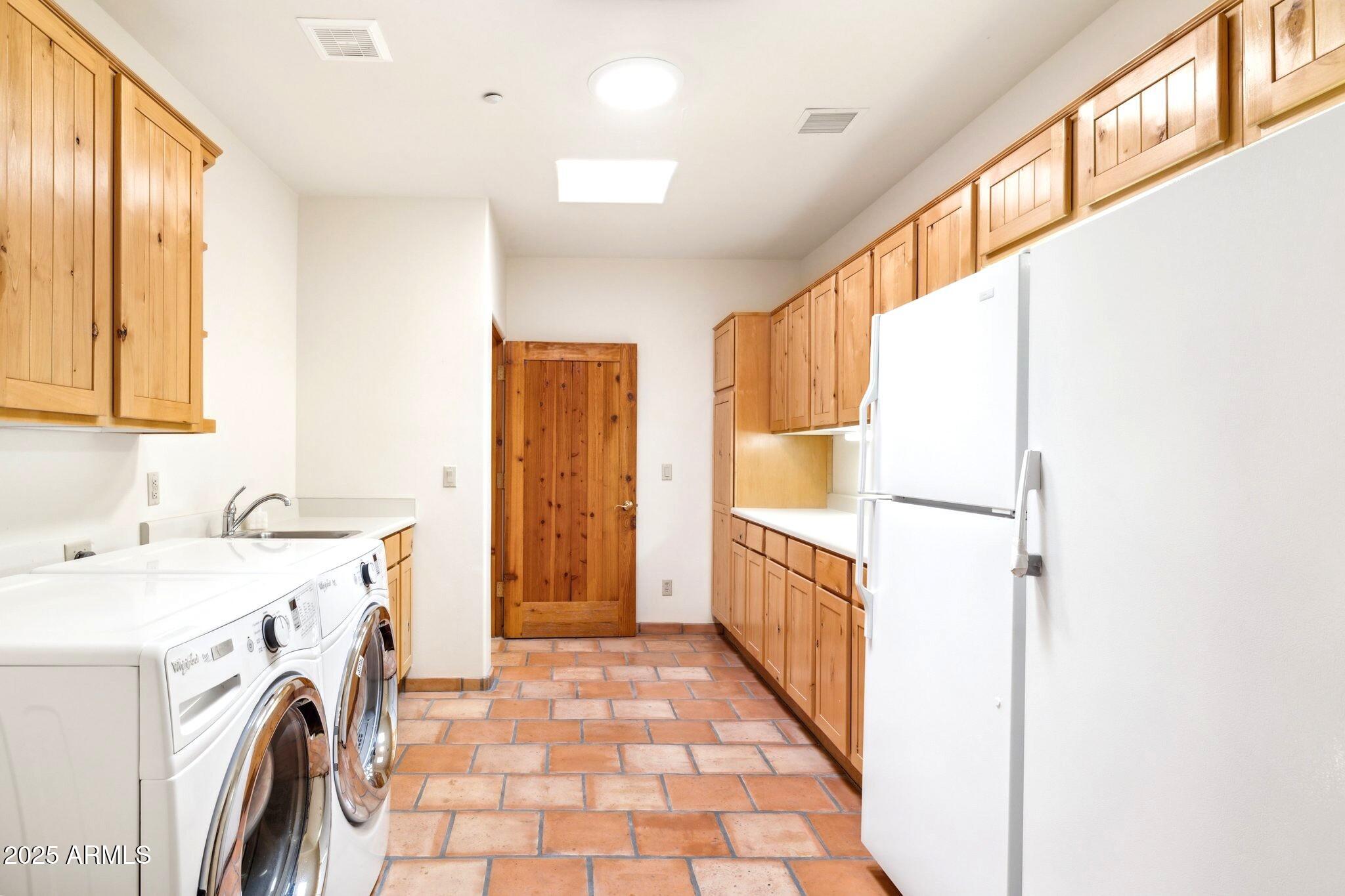 30600 North Pima Road, Unit 38 Scottsdale, AZ 85266 - Photo 41 of 49 a view of a kitchen with refrigerator and washer