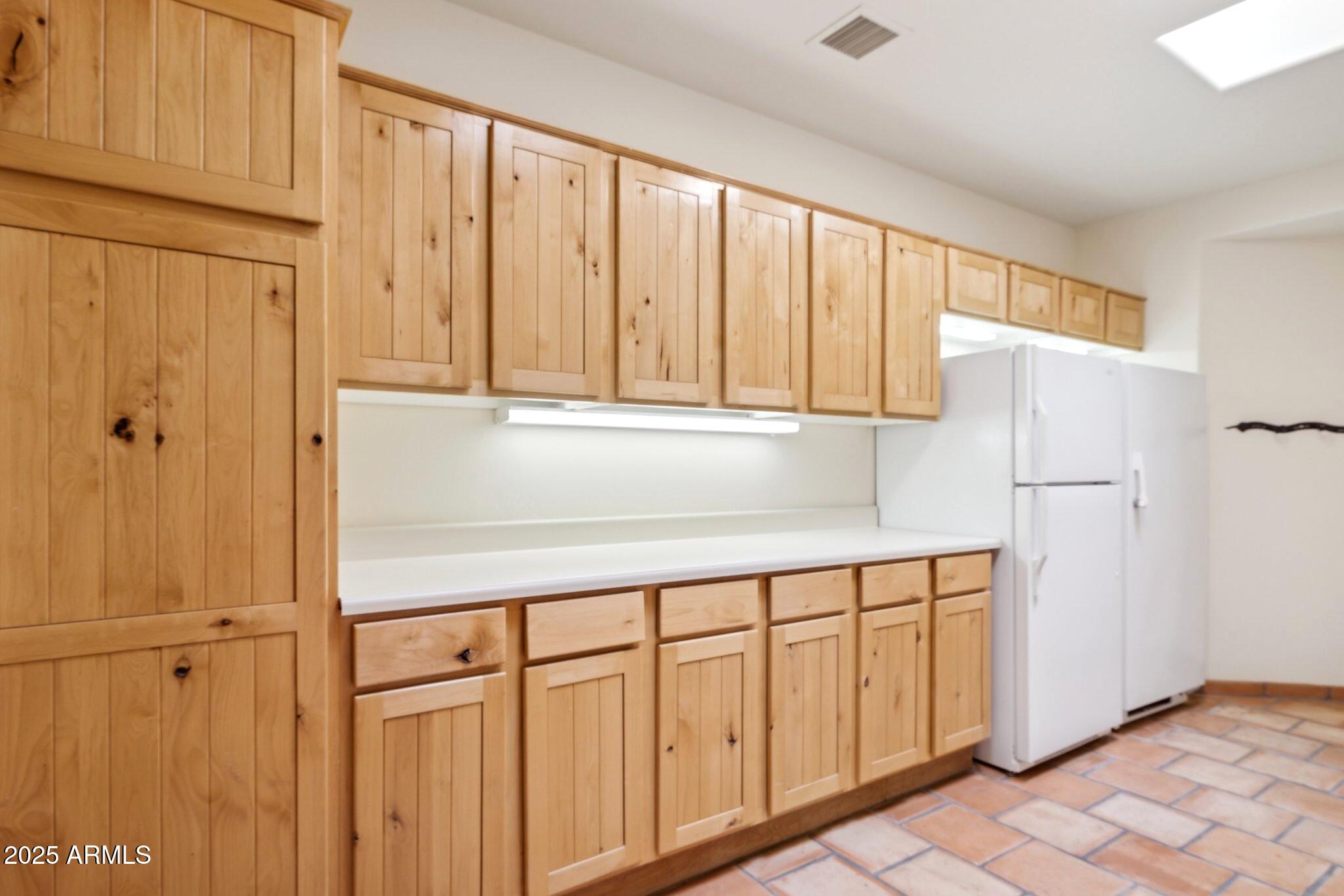 30600 North Pima Road, Unit 38 Scottsdale, AZ 85266 - Photo 42 of 49 a kitchen with a white cabinets and sink