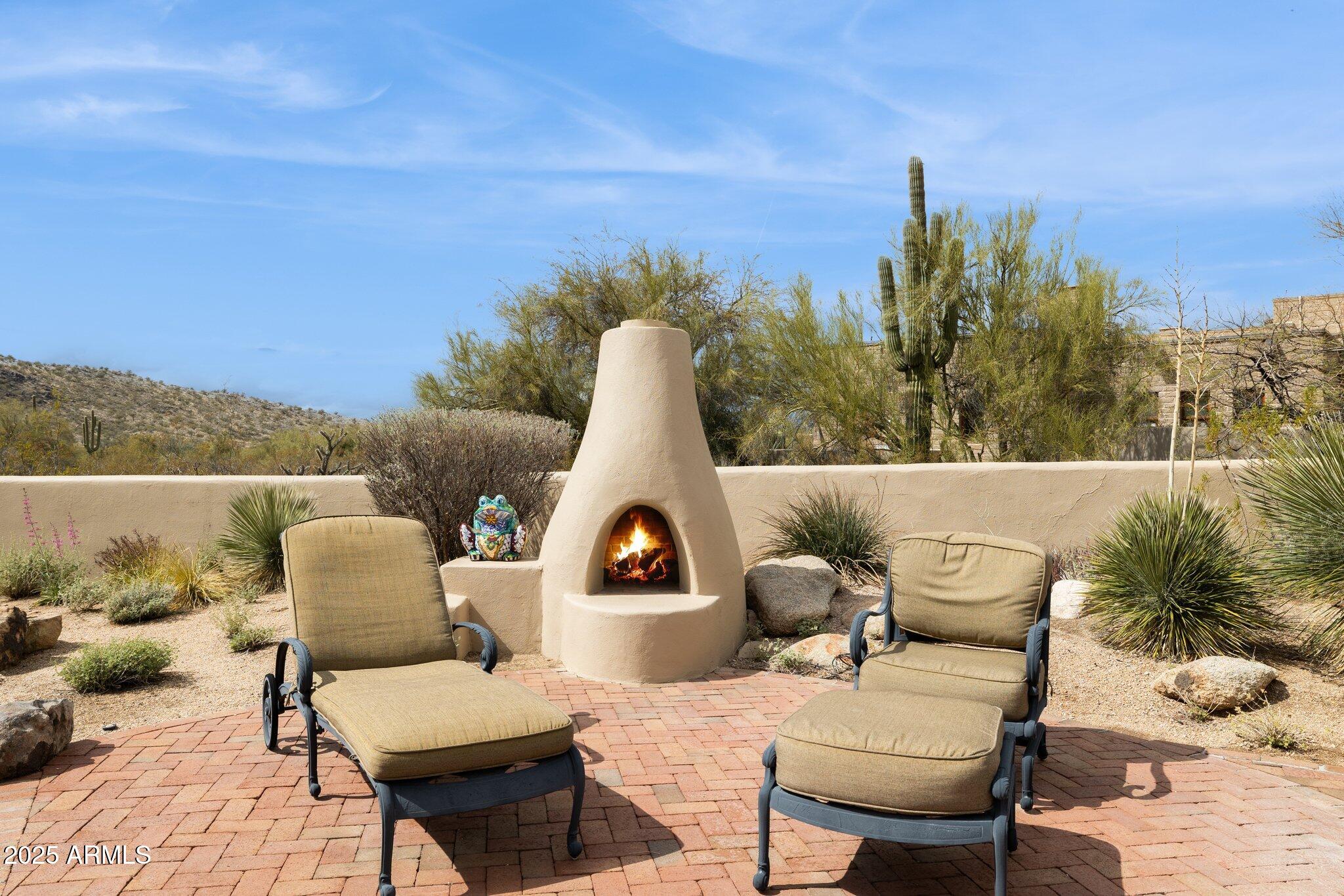 30600 North Pima Road, Unit 38 Scottsdale, AZ 85266 - Photo 43 of 49 a view of a terrace with couches and wooden fence