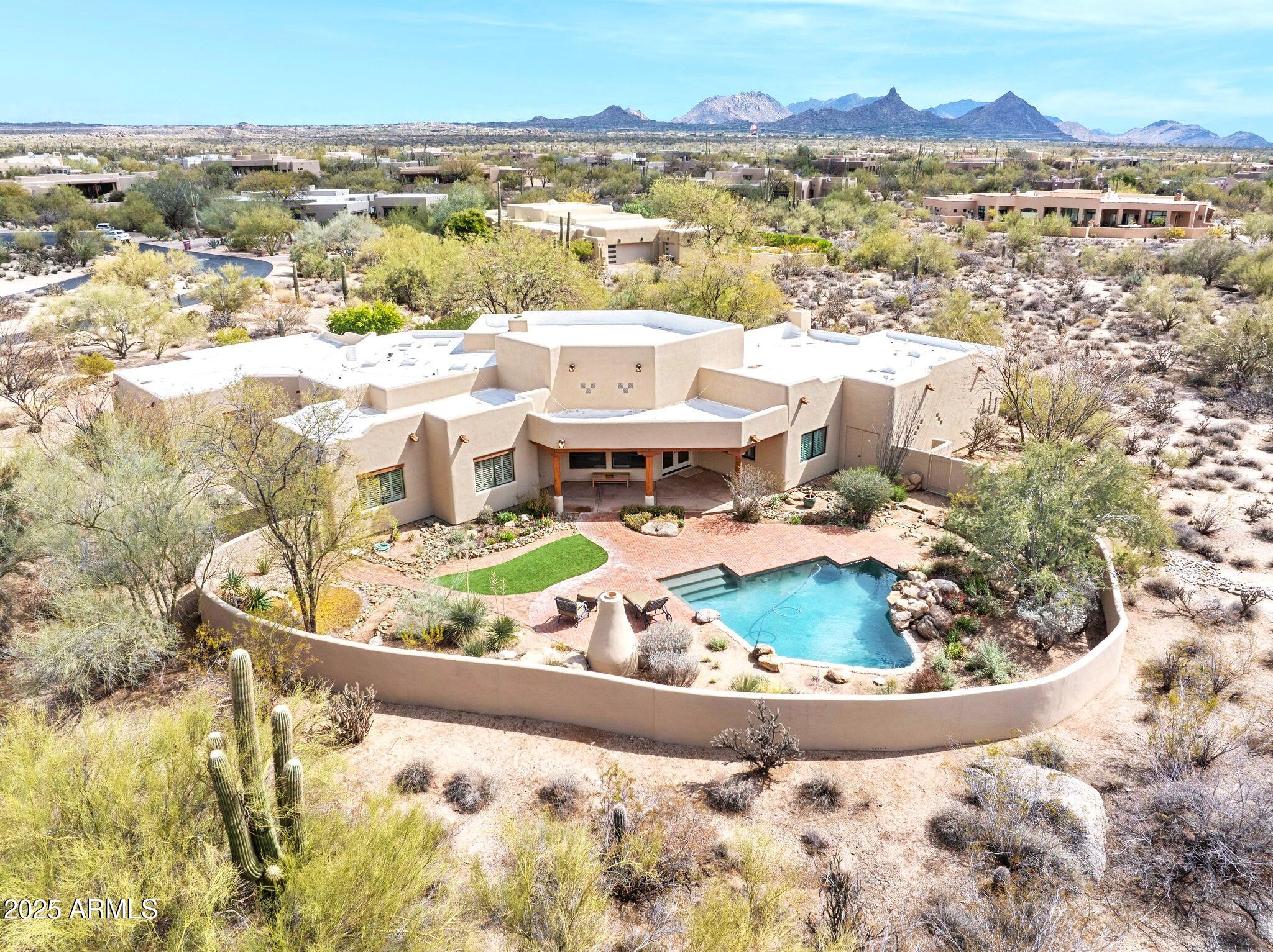 30600 North Pima Road, Unit 38 Scottsdale, AZ 85266 - Photo 47 of 49 an aerial view of residential houses with outdoor space
